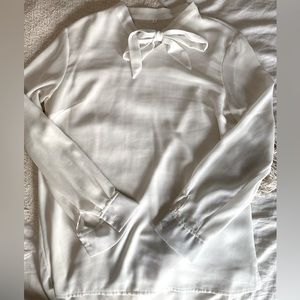 White sheer long sleeve blouse with tie at the neck